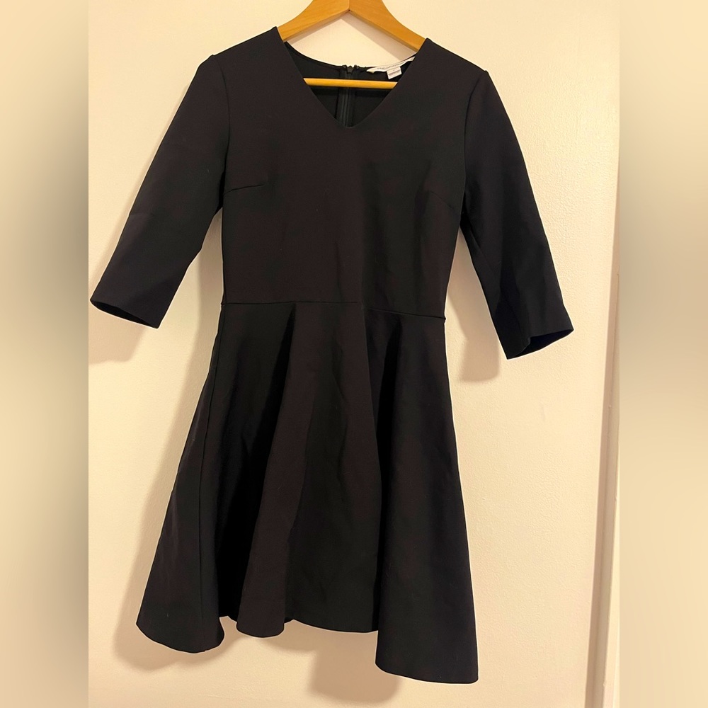 Diane Von Furstenberg stretchy flattering little black dress, size 8.